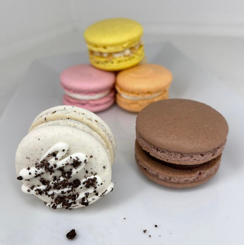 Assorted macarons on a white surface