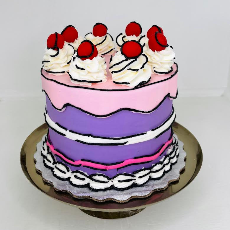 Two-tiered cake with purple and pink frosting, white whipped cream, and red berries on a white background.