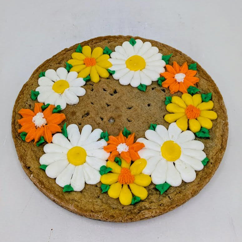 Cookie with floral decorations on a white background