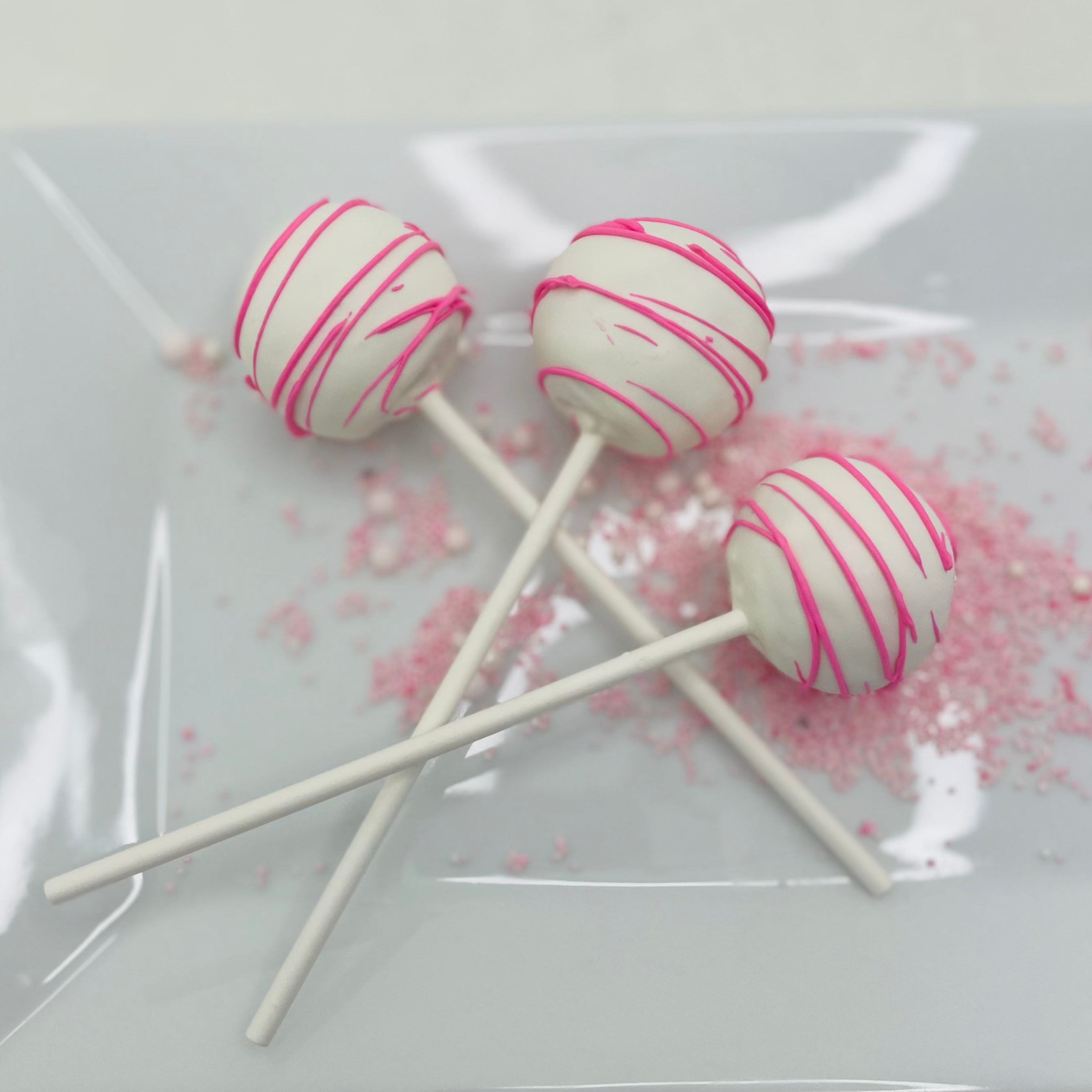 White & Pink Drizzle Cherry Chip Cake Pops