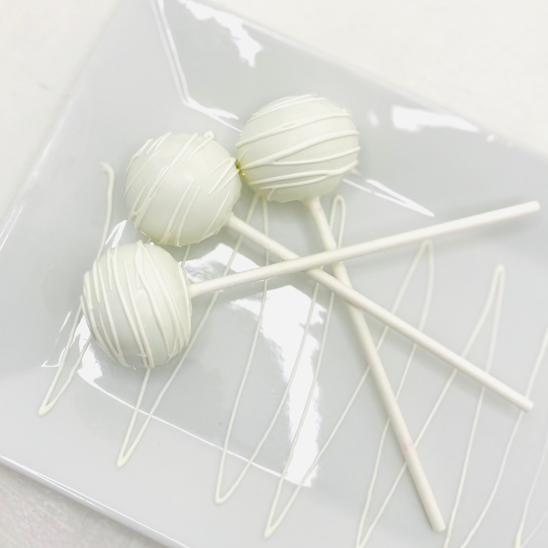 White with White Drizzle Butter Pecan Cake Pops